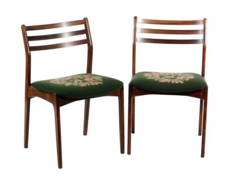 In the manner of Niels O. Moller - A set of ten rosewood ladderback dining chairs with tapered legs, the seats re-upholstered