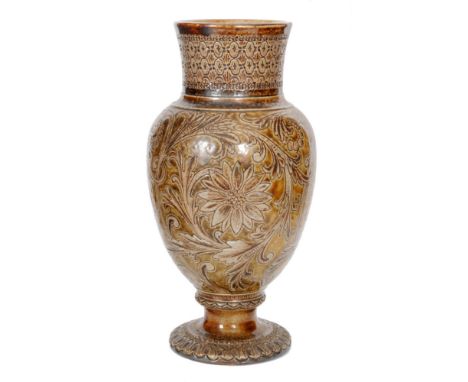 Robert Wallace Martin - Martin Brothers - A baluster vase of footed form decorated with incised stylised flowers and foliate 