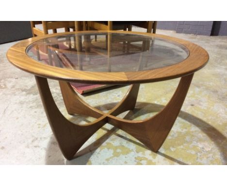 G-Plan - A teak model 8040 'Astro' coffee table of circular form with inset glass top, height 45cm and diameter 84cm.