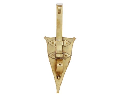 Birmingham Guild of Handicraft - An early 20th Century Arts and Crafts brass bracket, the shield back with affixed straps sup