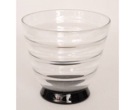 Simon Gate - Orrefors - A 1930s glass footed bowl, the clear body of flared form with optic ribbing upon a tapering black foo