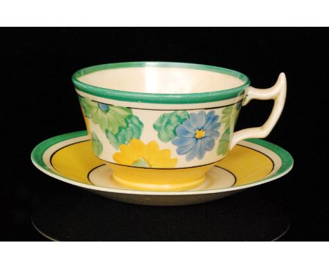 Clarice Cliff - Sungay - An Athens shape teacup and saucer circa 1931 hand painted with stylised flowers and foliage with bla