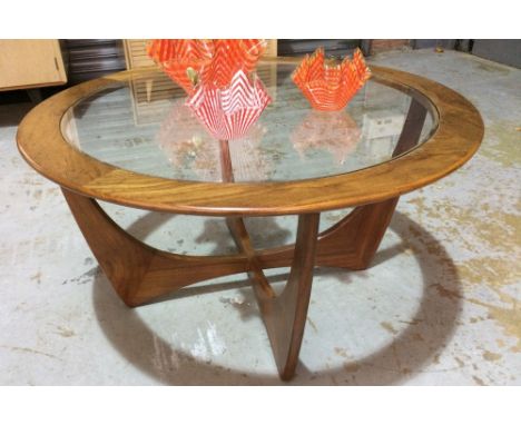 G-Plan - A teak model 8040 'Astro' coffee table of circular form with inset glass top, height 45cm and diameter 84cm.