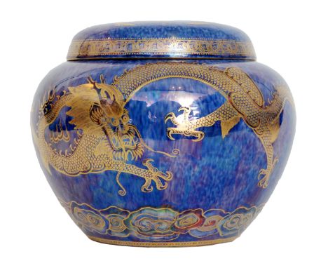 Daisy Makeig-Jones - Wedgwood - A Malfrey pot decorated with two snarling gilt dragons chasing a flaming pearl, all to a gree