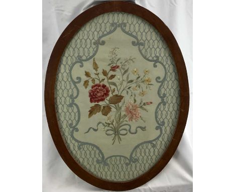 Victorian silkwork oval embroidered panel, a bunch of flowers in a posy with ribbon all within a rococo and lattice border. I