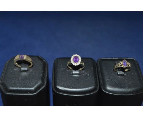 Three amethyst rings, on set diamonds, on 9ct yellow gold shanks.