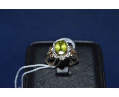 Peridot and diamond cluster ring, on 9ct yellow gold shank, ring size N.