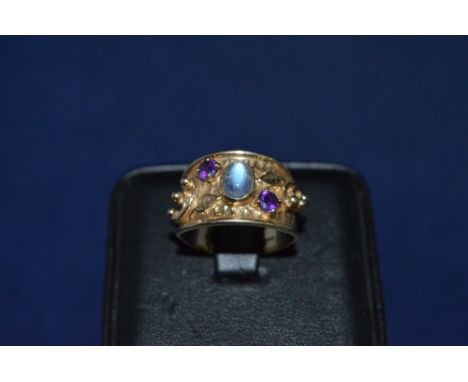 Moonstone and garnet ring, in 9ct yellow gold beadwork mount and shank, ring size P 1/2.