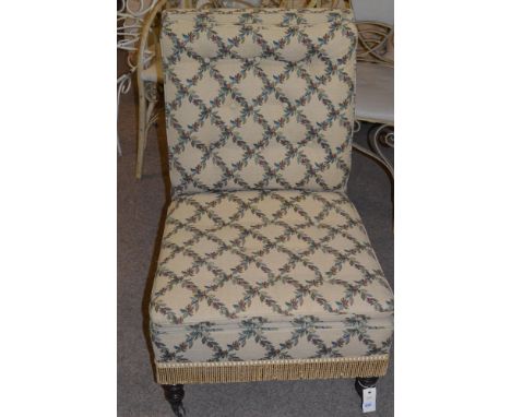 A 19th Century nursing chair, upholstered in modern tapestry style fabric with trellis floral design on cream ground, raised 