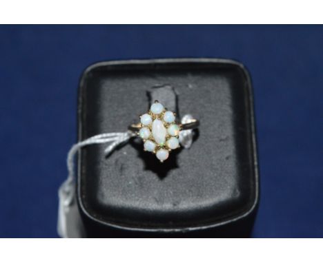 Opal cluster ring, on 9ct yellow gold shank, ring size O.