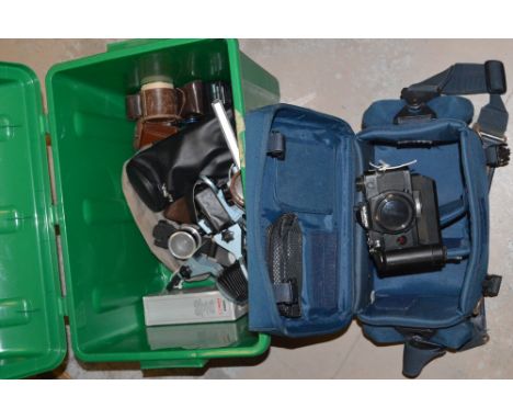 An Olympus OM-4 35mm SLR camera, fitted OM-2 winder; Photographic sundries, including: a close-up bellows unit; a Velbon mini