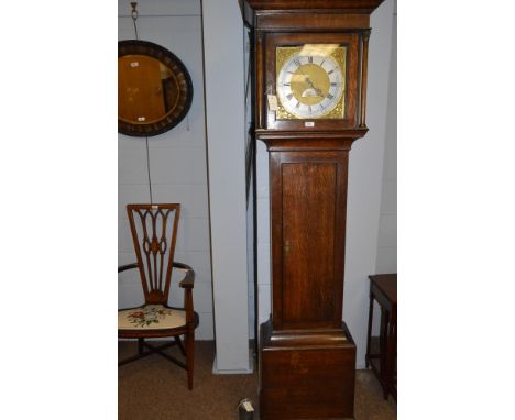 A rustic oak cased longcase clock, with silvered roman dial and second subsidiary dial inscribed 'J.N. Whitfield, Clifton', t