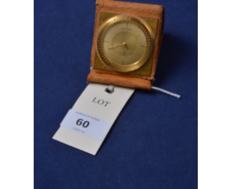 Jaeger-LeCoultre: A folding travel clock with leather case, the dial 4.5cms.