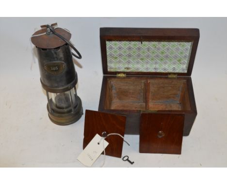 A Victorian tea caddy; together with a metal Patterson Miners lamp.