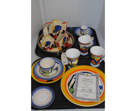 Two trays of Clarice Cliff Bizarre pattern china, to include: a limited edition plate; cup and saucer; and other china in the