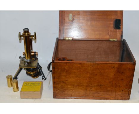 A Watson microscope in fitted wooden case, with accessories.