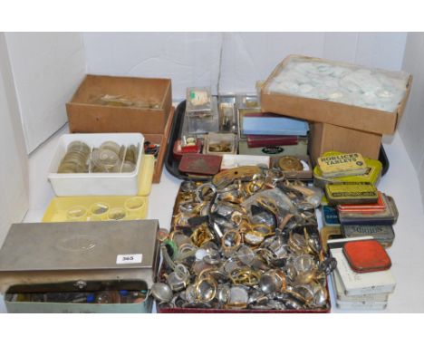 A quantity of assorted watch parts, to include: glass; gears; cases; tools; and other accessories.