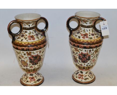 A pair of Zsolnay type urn-shaped vases, 37cms high.