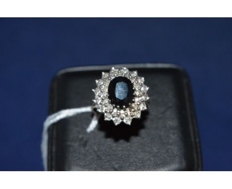 Sapphire and diamond cluster ring, on 9ct yellow gold shank, ring size N.