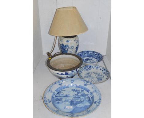 Oriental blue and white dishes and bowls; together with a blue and white ceramic table lamp.