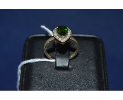 Green stone and diamond cluster ring, probably tourmaline, on 9ct yellow gold shank, ring size O.