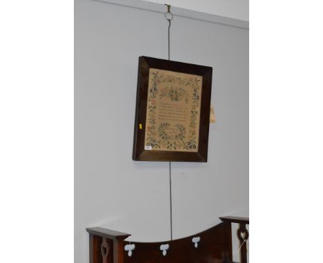 A framed needlework sampler, the work of Ellen Dorothy Jones, aged 9 years, 1840, in chamfered rosewood frame, measuring 42 x