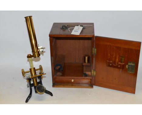 A vintage brass microscope in fitted box.