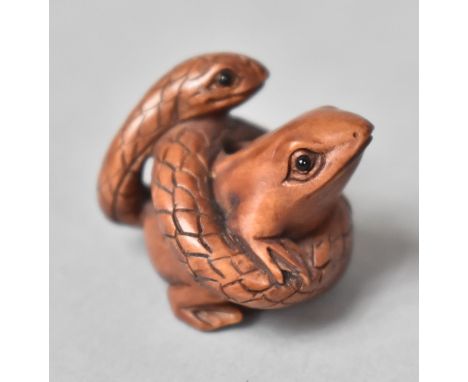 A Carved Wooden Netsuke in the form of a Snake Entwining a Frog 