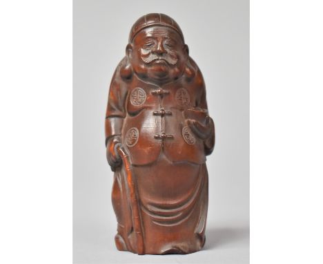 A Carved Wooden Chinese Study of Moustachioed Elder with Walking Stick Clutched in Hand, 8.5cm high