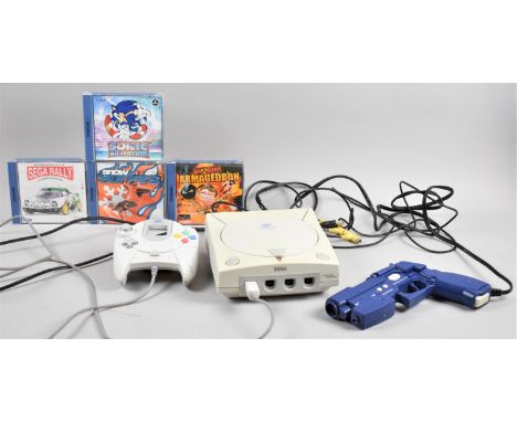 A Vintage Sega Dreamcast with Controllers and Four Games 