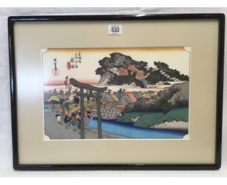COLOURED JAPANESE WOOD BLOCK PRINT OF FIGURES CROSSING A BRIDGE, EXTENSIVE LABEL DETAILS TO REVERSE, 14" X 20”