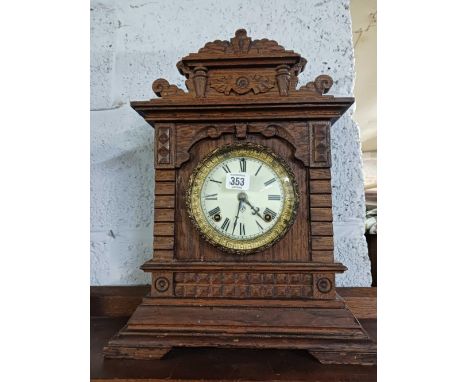 CARVED OAK MANTEL CLOCK