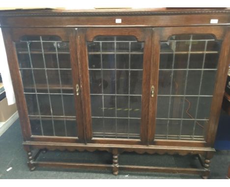 OAK LEADED GLASS DOOR CABINET ON BOBBIN TURNED LEGS