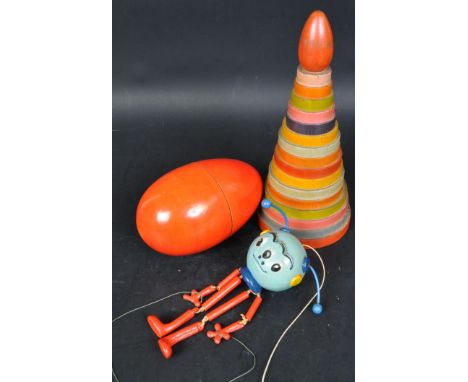 A collection of retro vintage 20th Century wooden game / puzzle toys. Having a Russian doll egg, circular pyramid game and a 