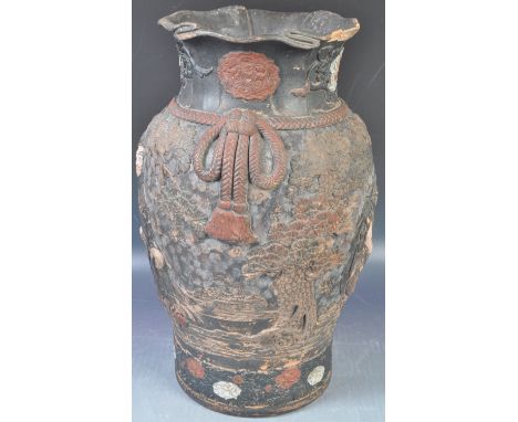 An 19th Century Japanese Meiji period terracotta hand painted vase having a flared rimwith floral decoration to the waisted n