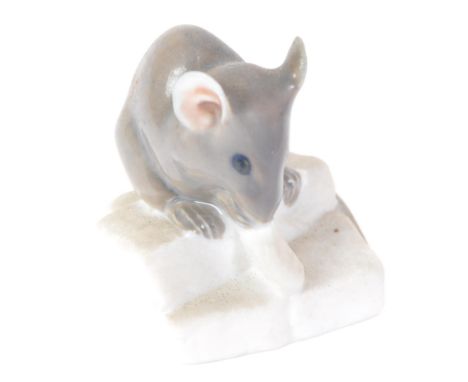 Royal Copenhagen - Vintage 20th Century a ceramic mouse on sugar cubes. Measures approx. three cm high.&nbsp;