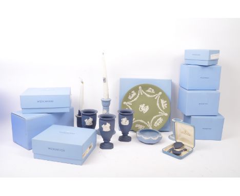 Wedgwood - A collection of NOS New Old Stock boxed Wedgwood Portland blue Jasperware to include candlesticks, Eros laurel vas