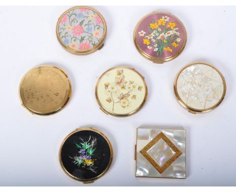 A collection of seven vintage 20th Century make up compact cases. Comprising of Stratton, England, American beauty made in US