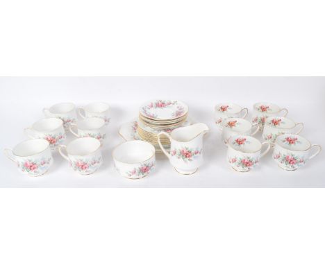 A vintage 20th century bone china Royal Standard tea service in the Rambling Rose pattern. The service comprising of teacups,
