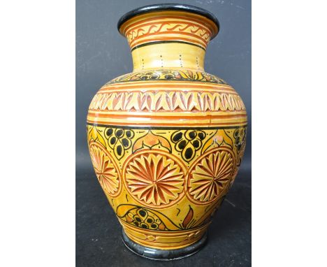 A vintage 20th century Moroccan 'Safi' ceramic pottery vase in orange &amp; yellow colourways with textured patterns &amp; bl