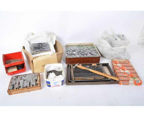 A large collection of vintage 20th century metal letterpress newspaper print pieces. Each set comprising of the alphabet alon