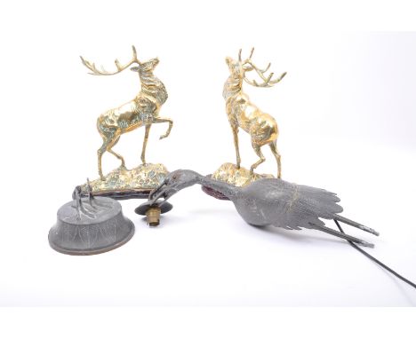 Two 20th century brass sculptures in the form of moose, each raised on socale bases. Together with a 1920s Chinese lamp in th
