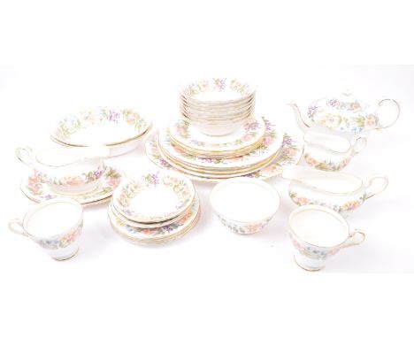 A 20th century vintage bone china Paragon tea and dinner service in the Country Lane pattern. Comprising of teacups, saucers,