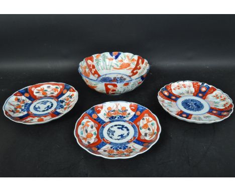 A collection of four Imari vintage 20th Century Japanese oriental Asian plates and bowl. Of blue, white and orange colour han