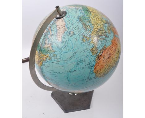 A 1970's retro Danish light up illuminating desktop Scan Globe. The globe set to a black hexagonal base with chrome arm, the 