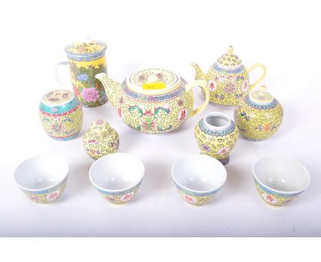 An assortment of vintage 20th century ceramic Chinese Oriental Famille Rose items. The lot to include two tea pots, ginger ja