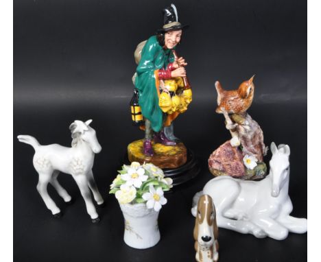 An assortment of vintage 20th century English &amp; continental bone china figures. The lot comprising of a Royal Doulton 'Th