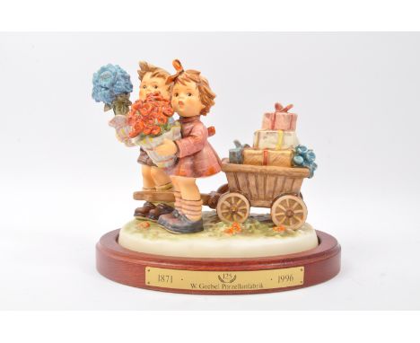 Goebel Hummel - Loves Bounty - A large vintage 20th century German porcelain Hun 751 figure in the form of a young boy and gi
