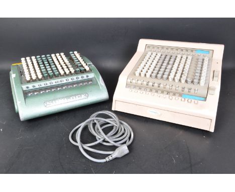 A pair of vintage retro mid 20th century Sumlock comptometer early computers in a green and mauve colourway.&nbsp;