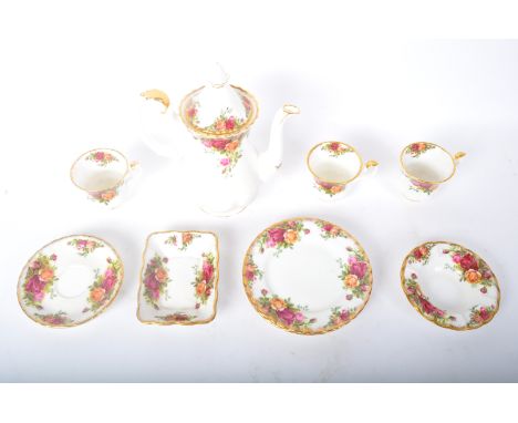 A vintage 20th century Royal Albert Country Roses bone china tea service. The service comprising of teacups, saucers, side pl